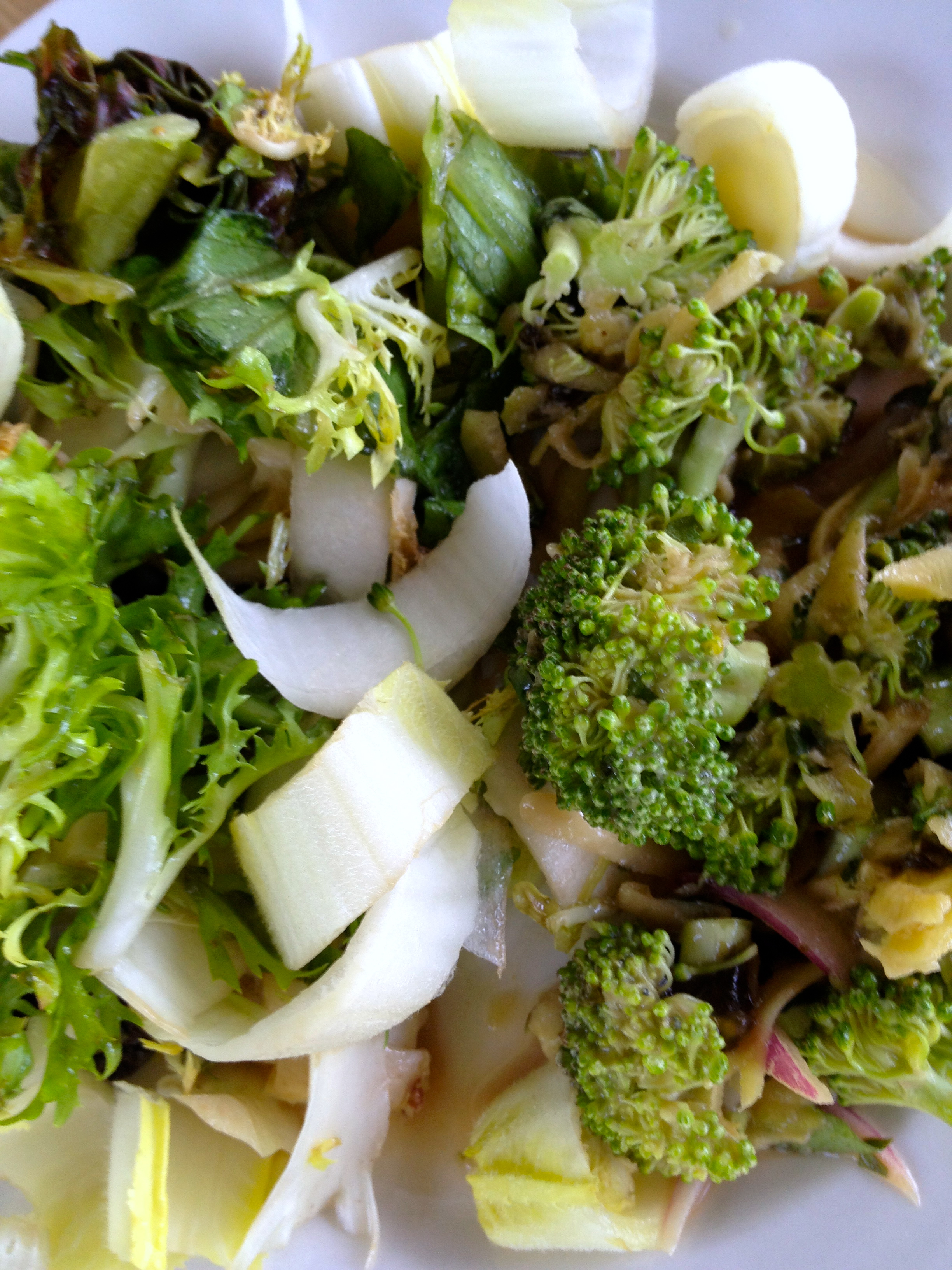 Frisee, red lettuce and endive salad with broccoli slaw